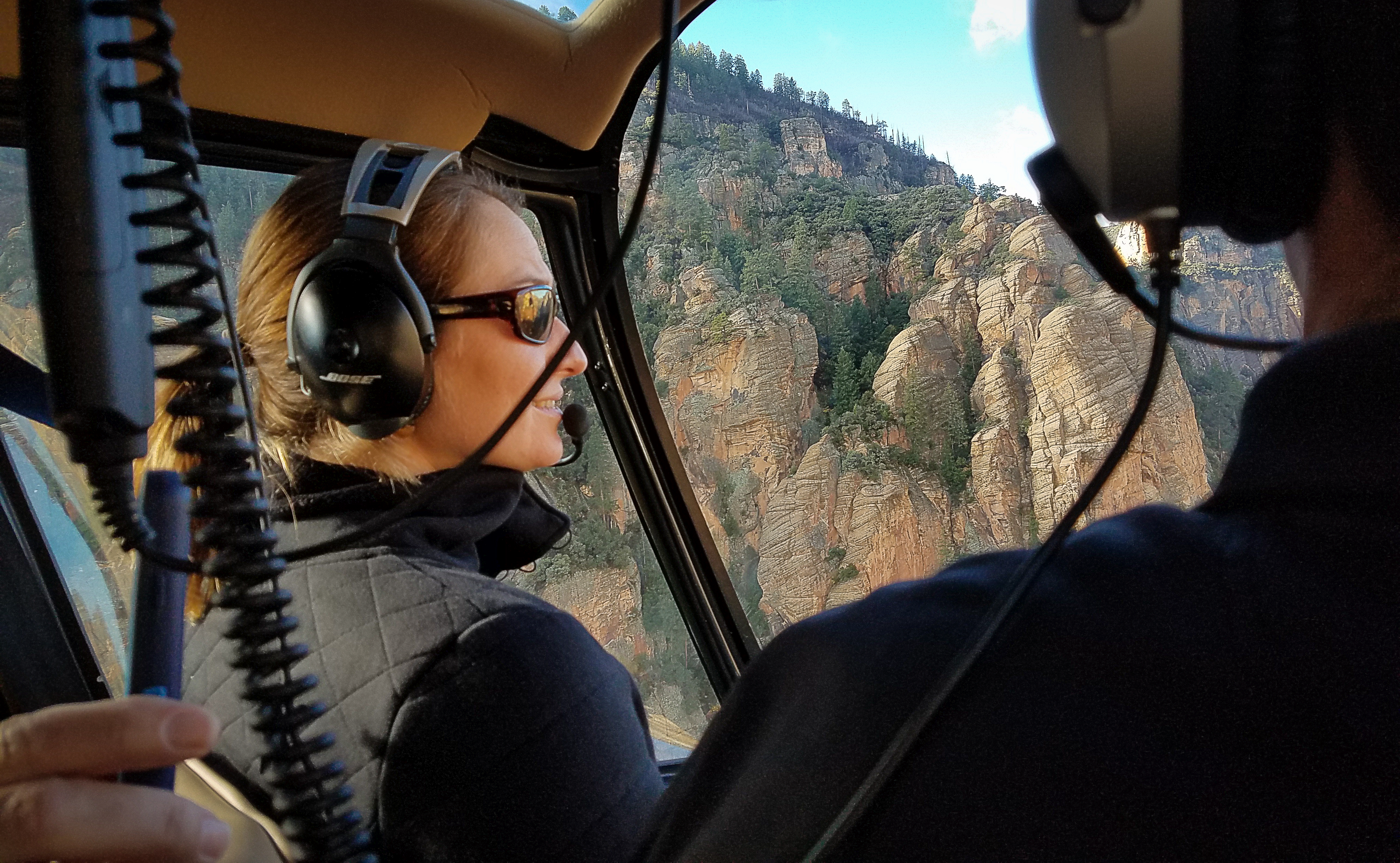 Guest Chelsea Taylor in flight aboard one of Guidance Air's Robinson R44 helicopters